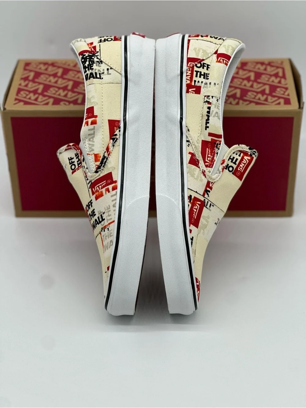 Vans Slip-On Sneakers in Cream, Red & Black Graphic Print